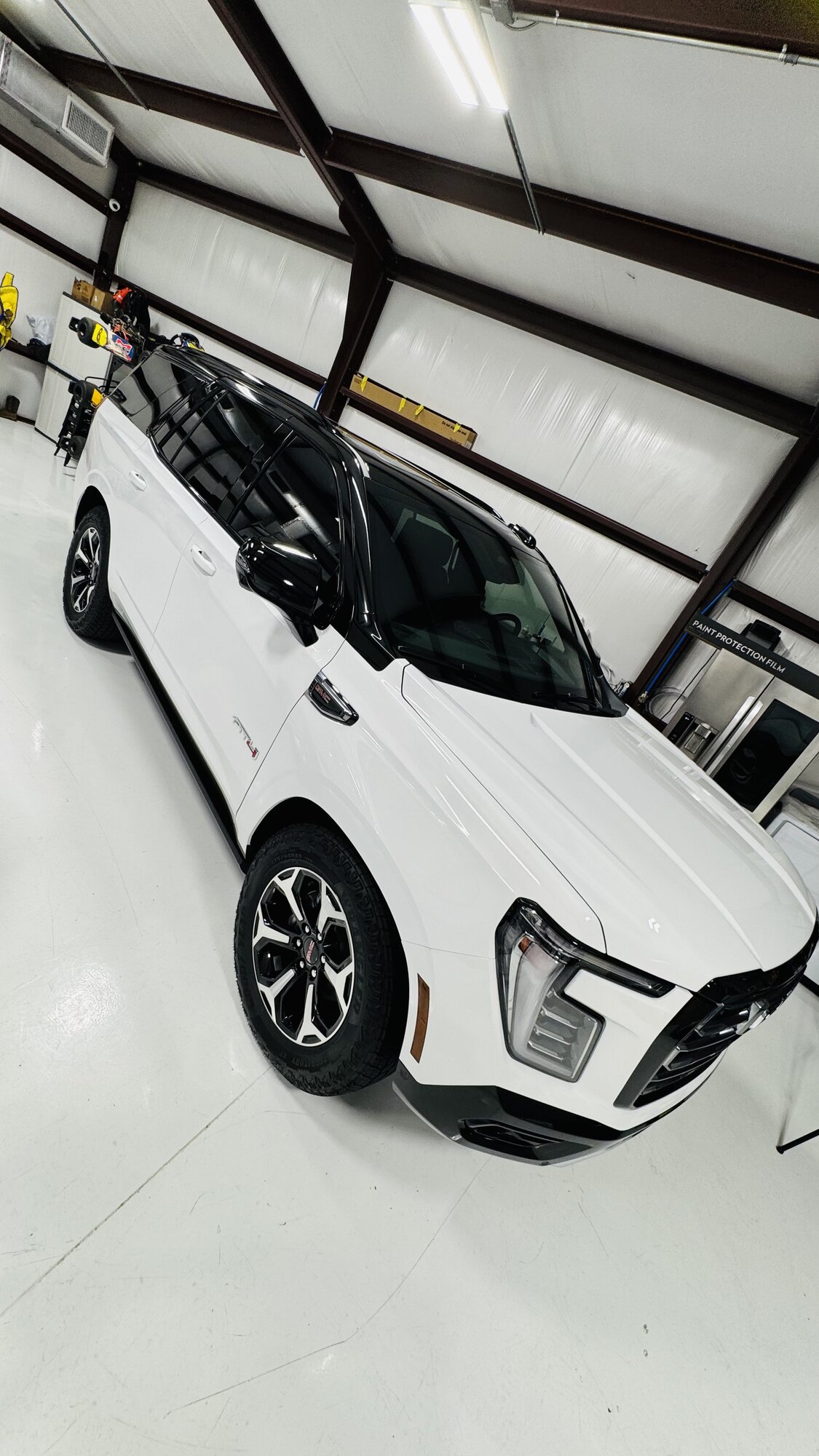 White GMC Yukon AT4 with gloss black roof and trim wrap