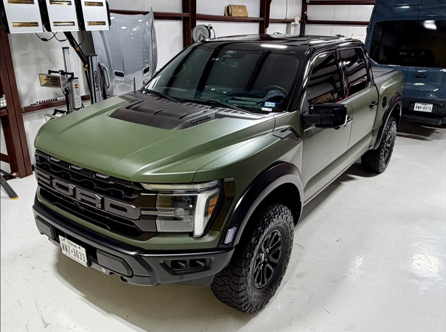 Ford Raptor wrapped in satin military green with a gloss black roof