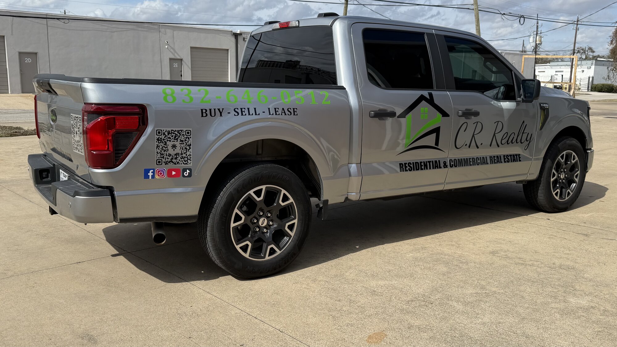 Silver CR Realty Ford F-150 with commercial graphics
