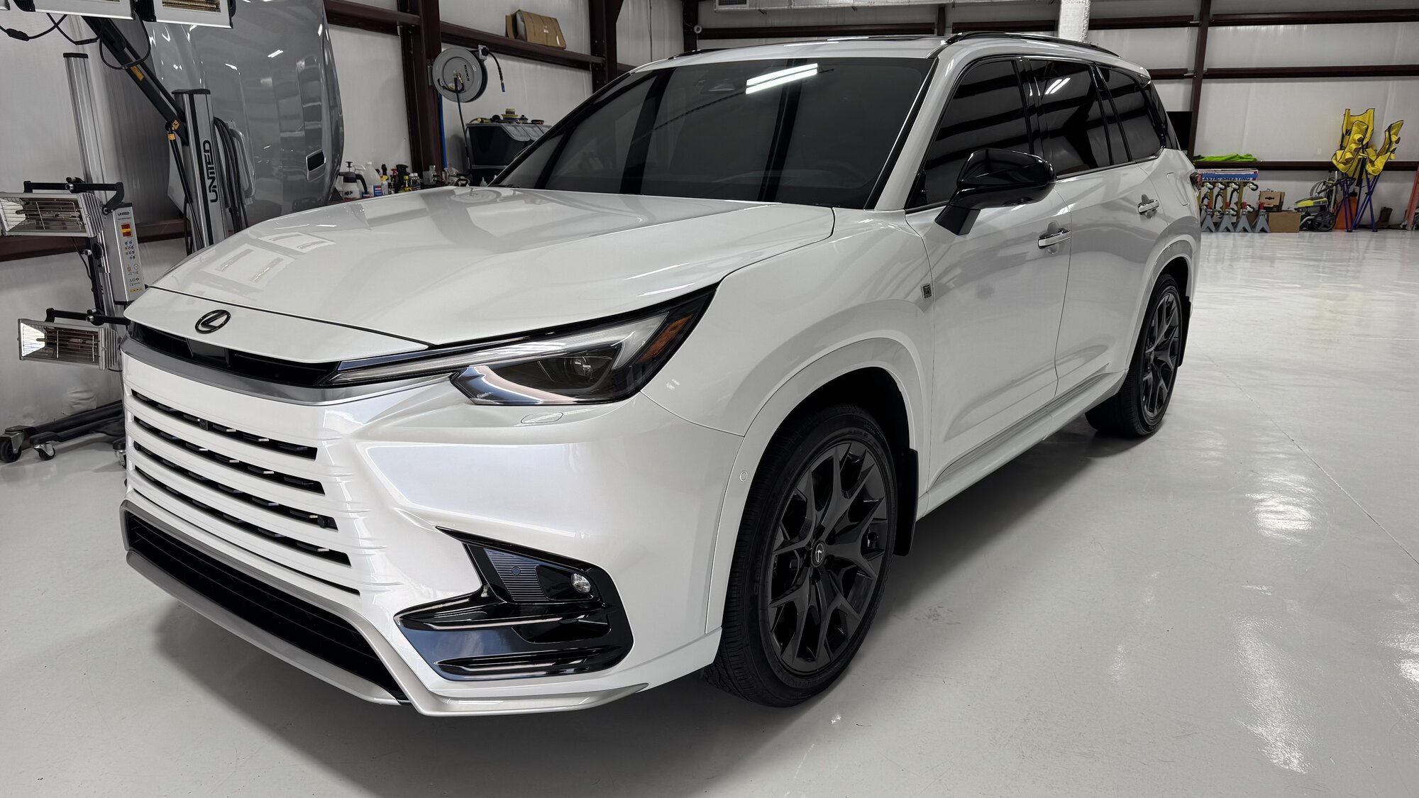 White Lexus TX with paint protection film in the studio